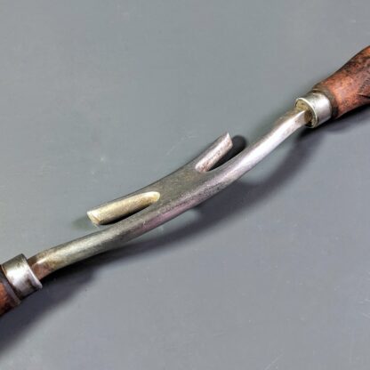 vintage sleeking iron with wooden handles