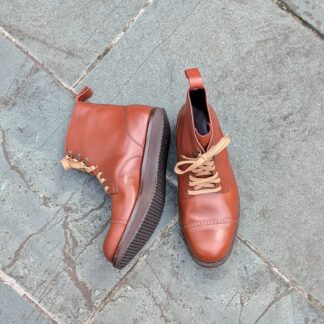 hybrid bespoke boot with rocker sole